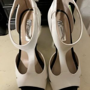 Used Black & White, size 7 zipper heel closing, Ankle height peep toe high heel.